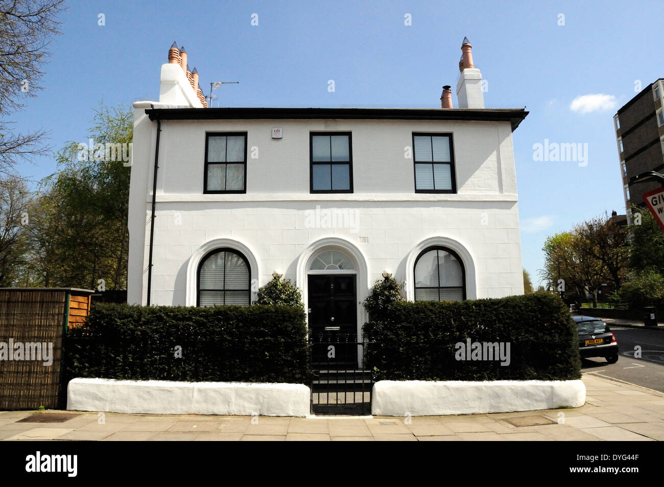 White painted detached corner Georgian house that was once part of a terrace Hemmingford Road Barnsbury Islington London England Stock Photo