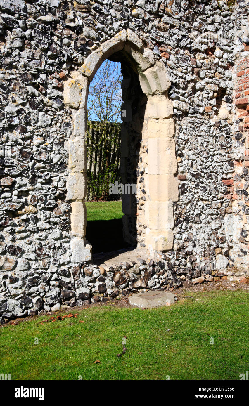 A feature doorway in the ruins of the cloister west wall at St Olave's Priory, Norfolk, England, United Kingdom. Stock Photo