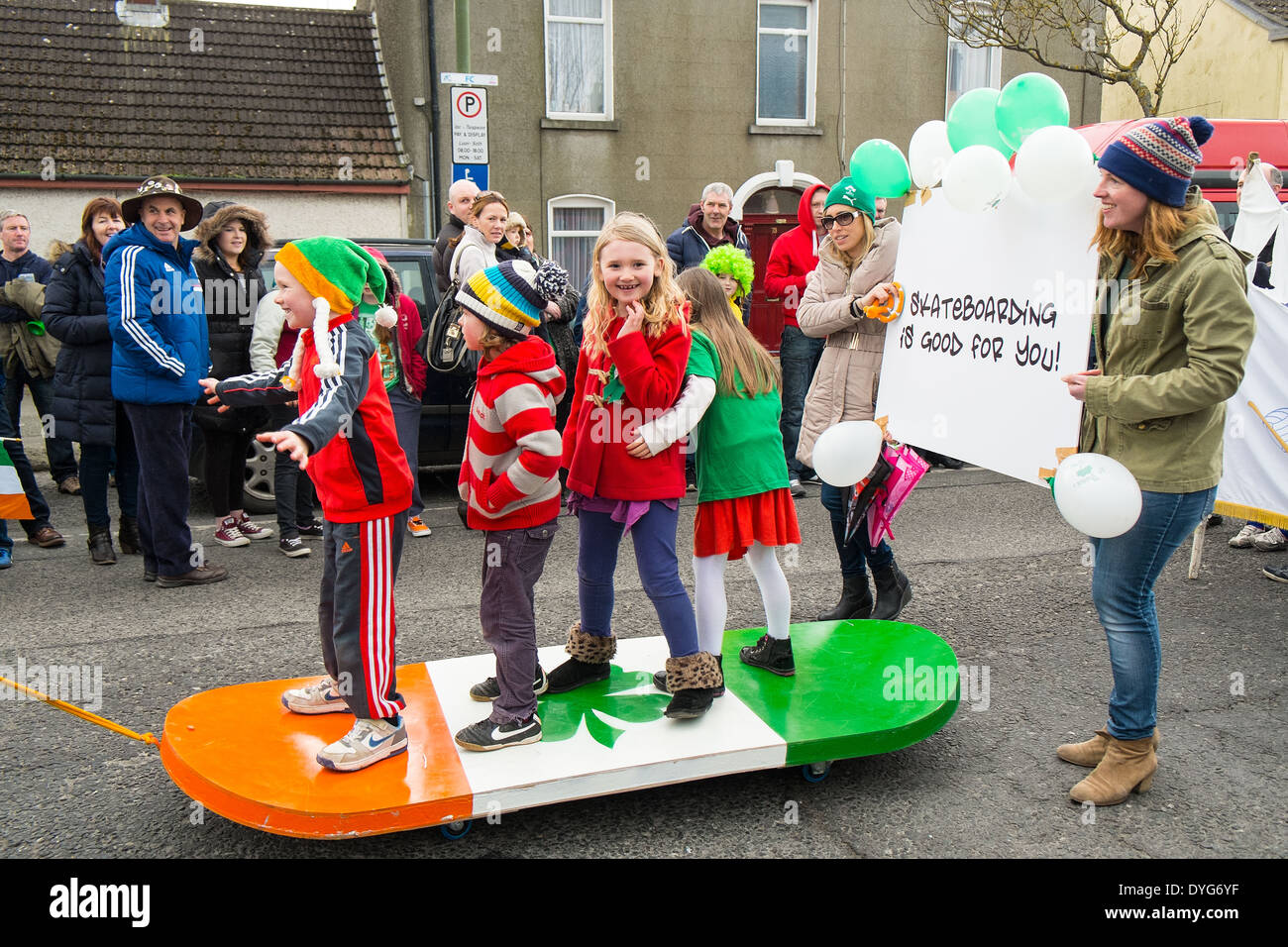 St Saint Patricks Day parade - kids on a giant skateboard - Village of Skerries, Dublin, Ireland Stock Photo