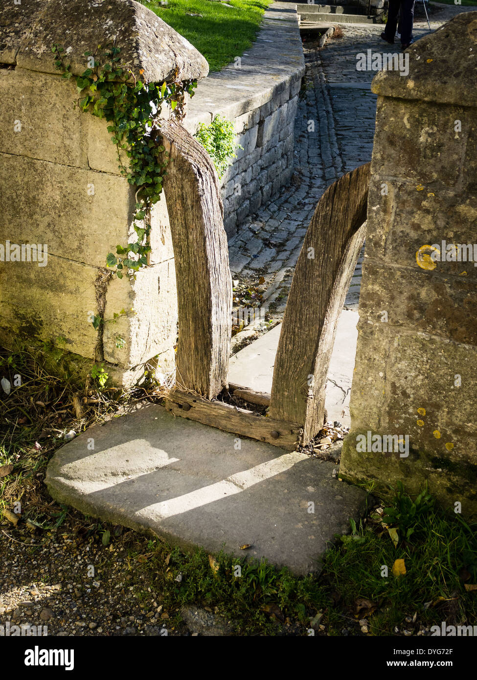 Unusual entry control to an English churchyard Stock Photo
