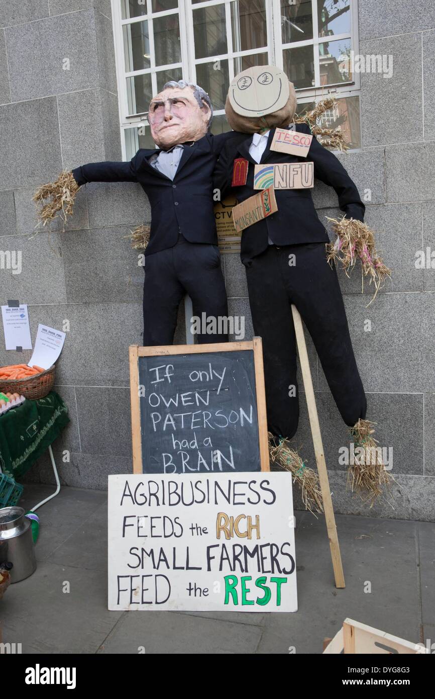 Landworkers Alliance demo outside DEFRA  headquarters to draw attention to the unhealthy relationship of large Agri Business to UK government. Stock Photo