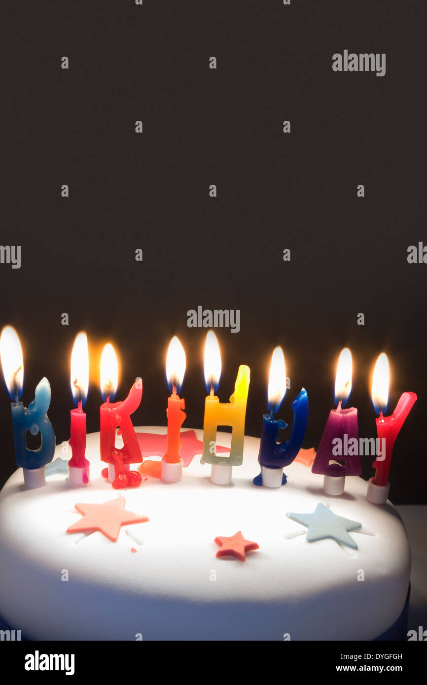 Birthday cake with lighted candles Stock Photo Alamy