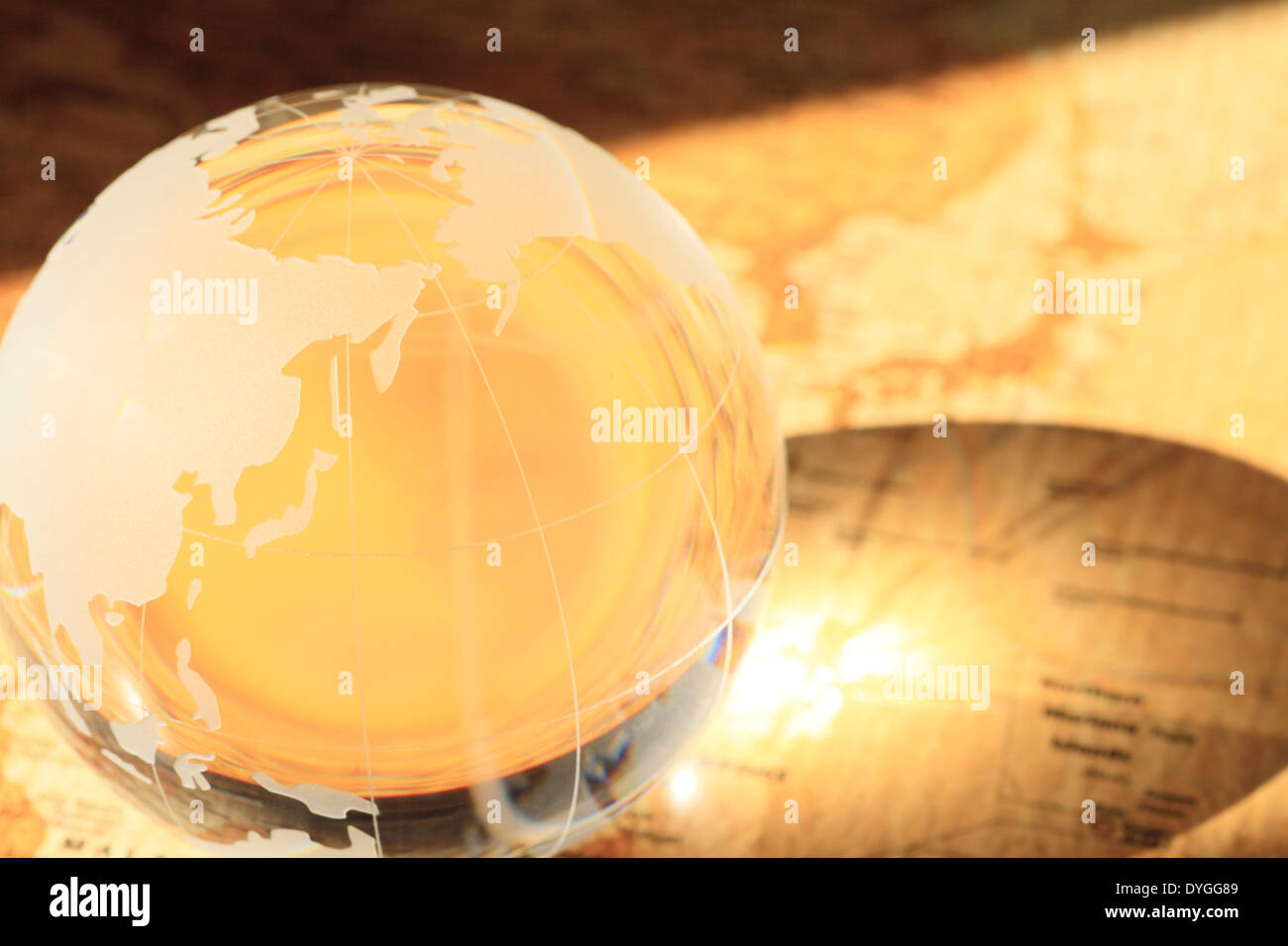 Glass globe on map Stock Photo