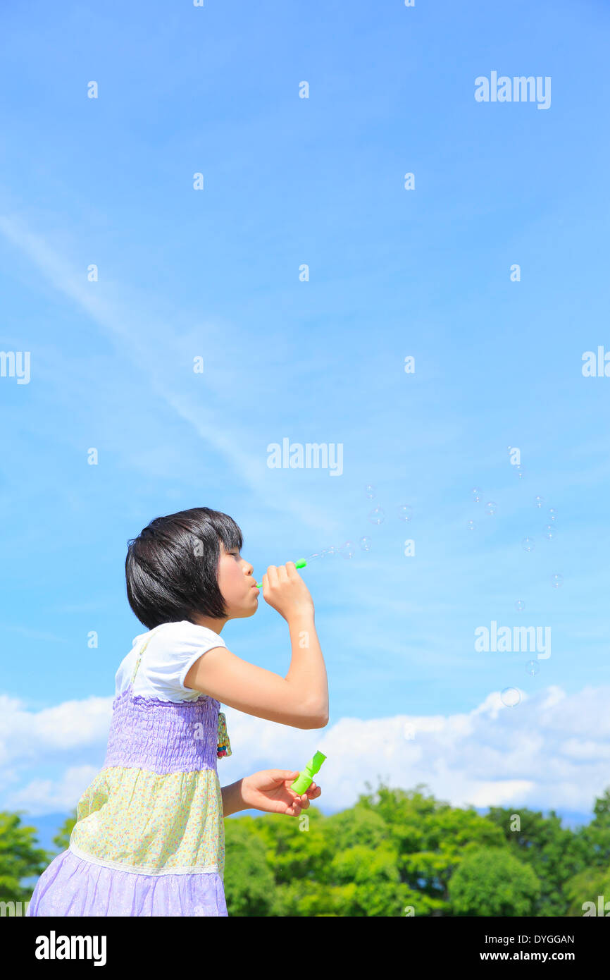 Japanese girl playing in nature Stock Photo - Alamy