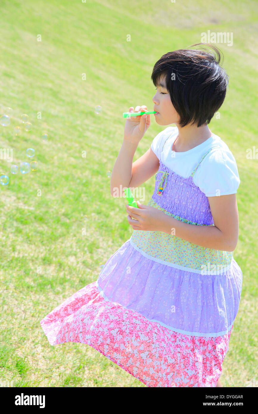 Japanese girl playing in nature Stock Photo - Alamy