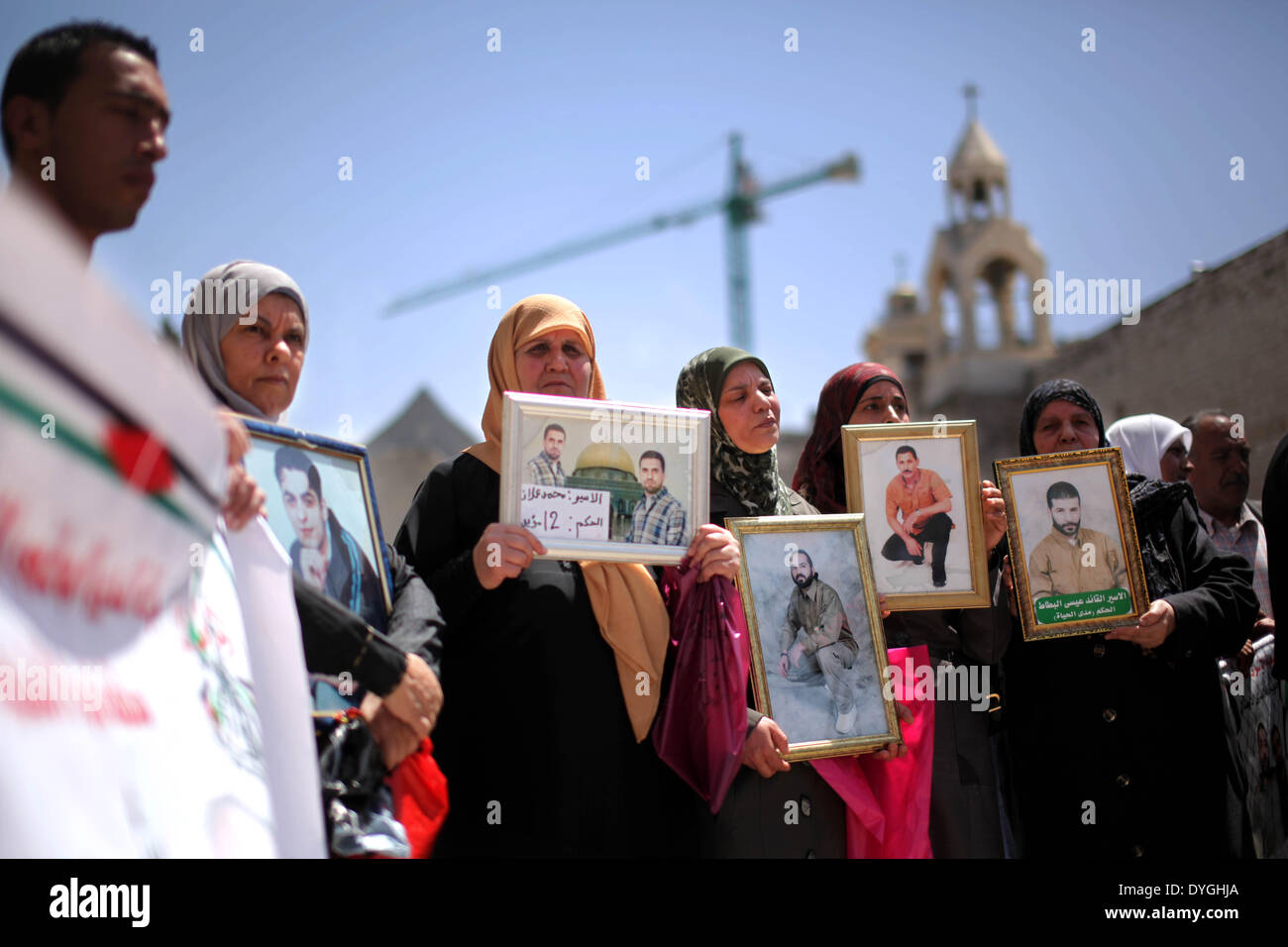 Bethlehem, West Bank city of Bethlehem. 17th Apr, 2014. Palestinians hold pictures of their relatives in Israeli jails as they take part in the commemoration marking Palestinian Prisoner Day, which is a solidarity day with Palestinians in Israeli jails, in the West Bank city of Bethlehem, on April 17, 2014. Credit:  Luay Sababa/Xinhua/Alamy Live News Stock Photo