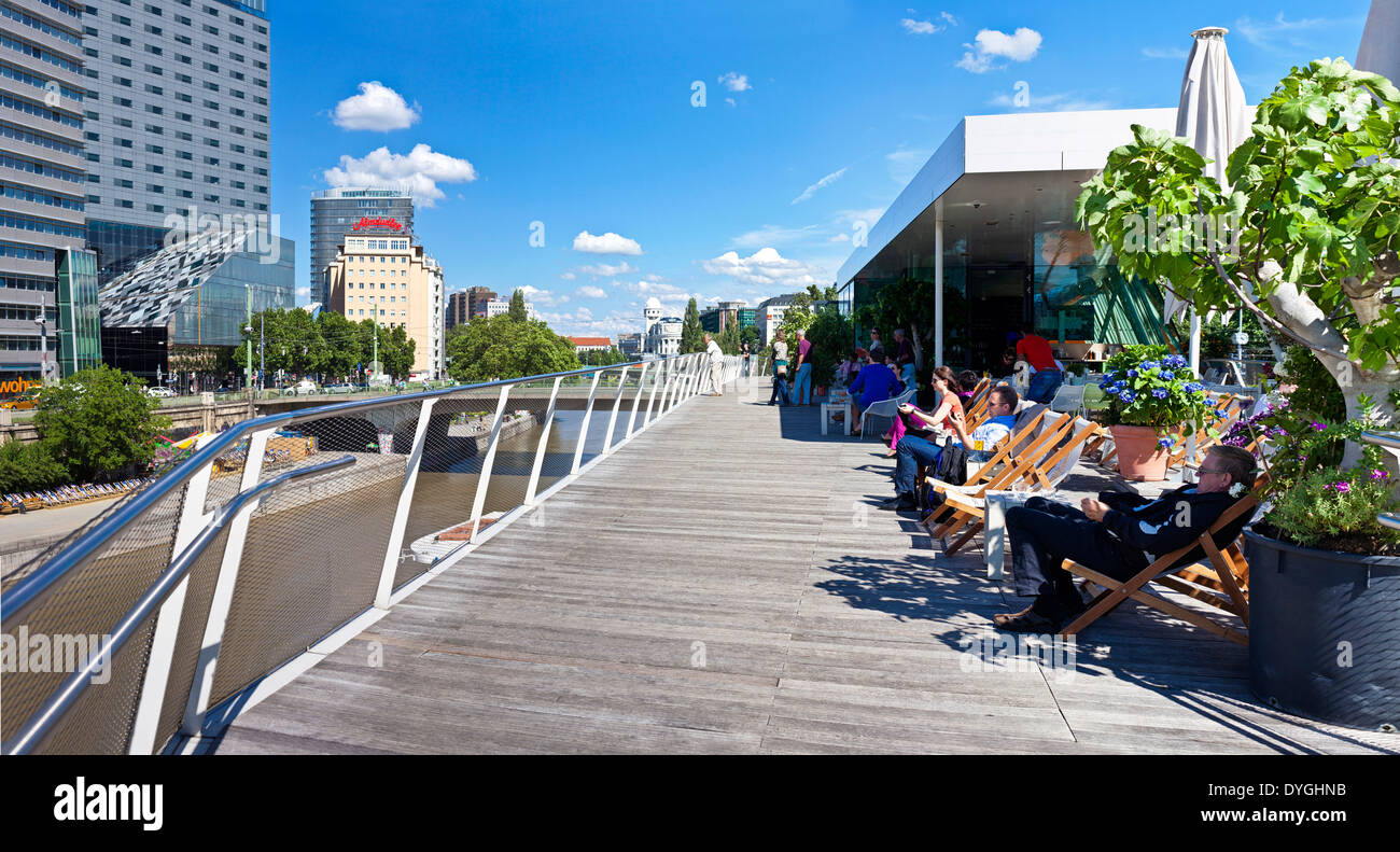Some people have a break at the Danube Canal of Vienna Stock Photo