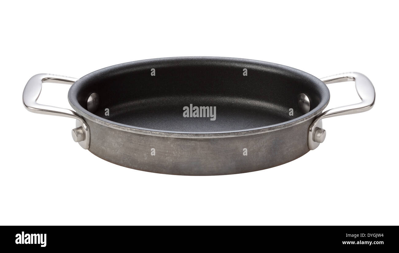 Oval Teflon Pan, with chrome handles, isolated on a white background. Stock Photo