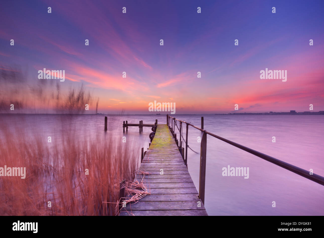 A small jetty on a lake at dawn Stock Photo