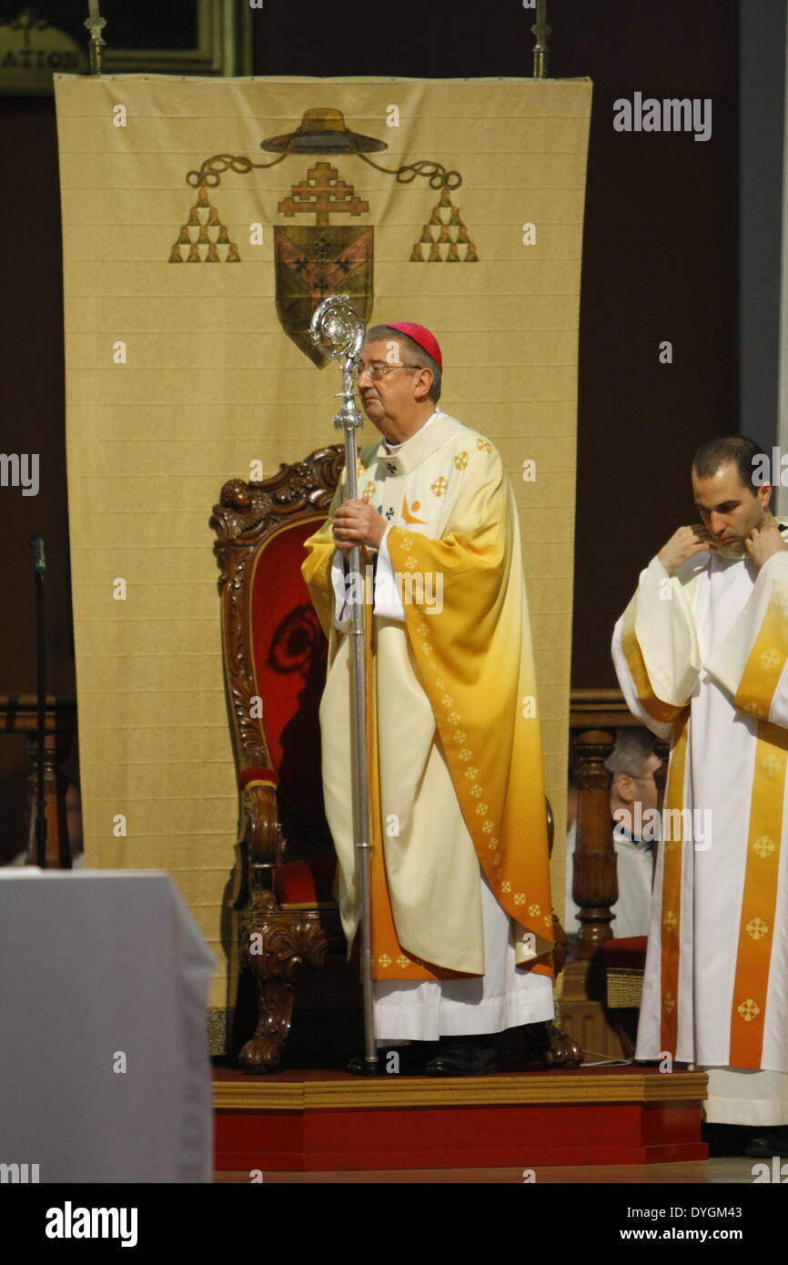 Dublin, Ireland. 17th April 2014. The Archbishop of Dublin Diarmuid Martin stands in front of the cathedra (Bishop's throne), holding his crosier (pastoral staff of the Bishop's office). Dublin's Roman Catholic Archbishop Diarmuid Martin led the Chrism Mass in Dublin's St. Mary's Pro-Cathedral. The mass, that takes traditional place on Holy Thursday, sees the Holy Oils being blessed for the coming year. It was attended by clergy from all parishes in the diocese. Credit:  Michael Debets/Alamy Live News Stock Photo