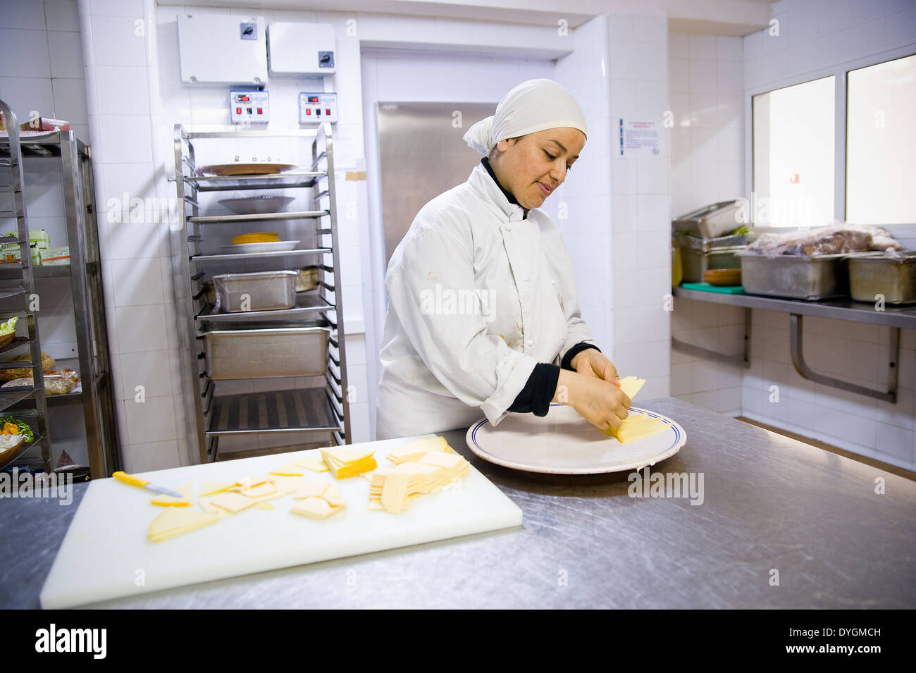TUNISIA, HAMMAMET: The tourism industry offers lots of jobs,also for women. They work on all levels, like her in the kitchen. Stock Photo