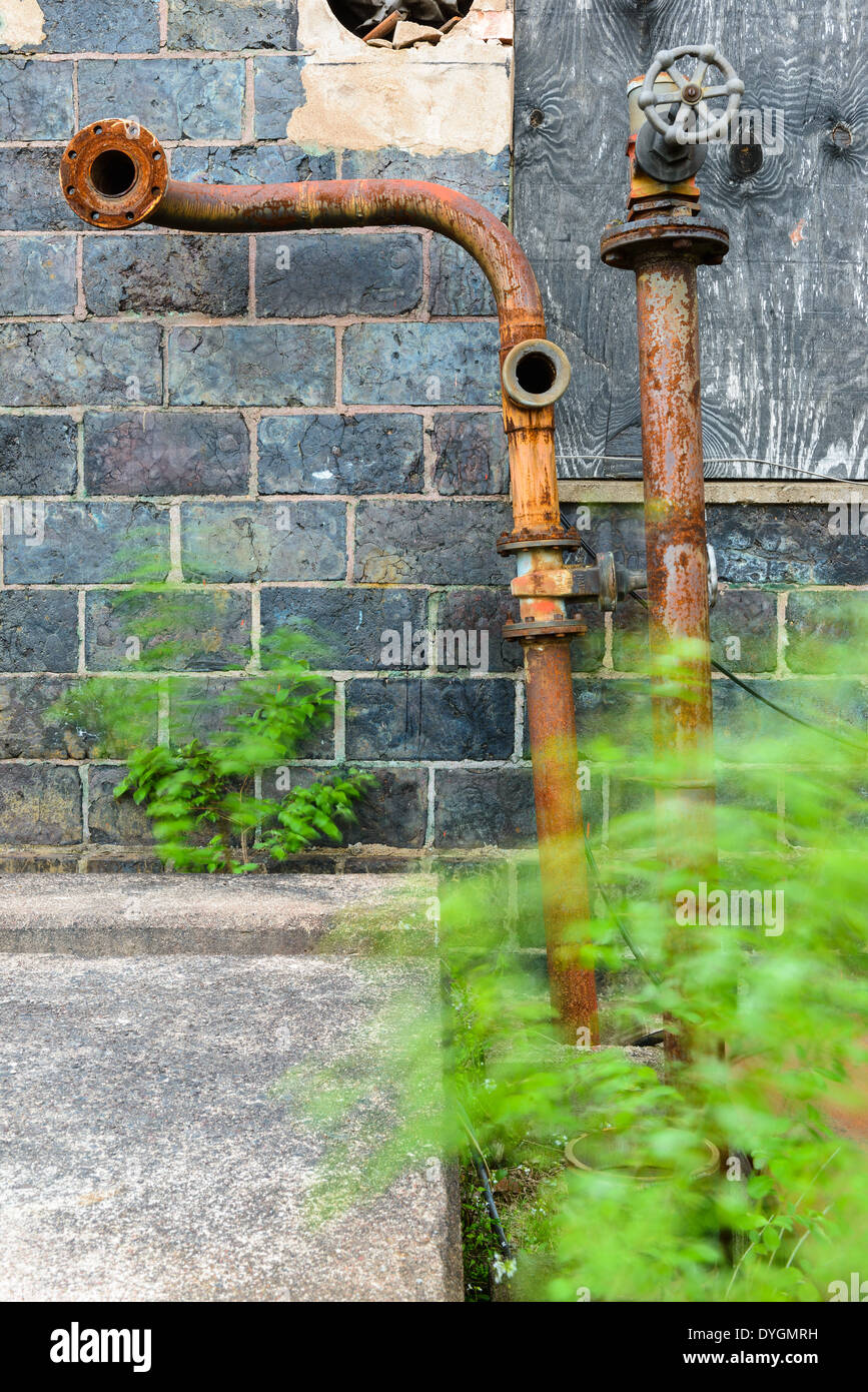 Rusty water pipes on wall, Falun, Falun Municipality, Dalarna County, Sweden Stock Photo