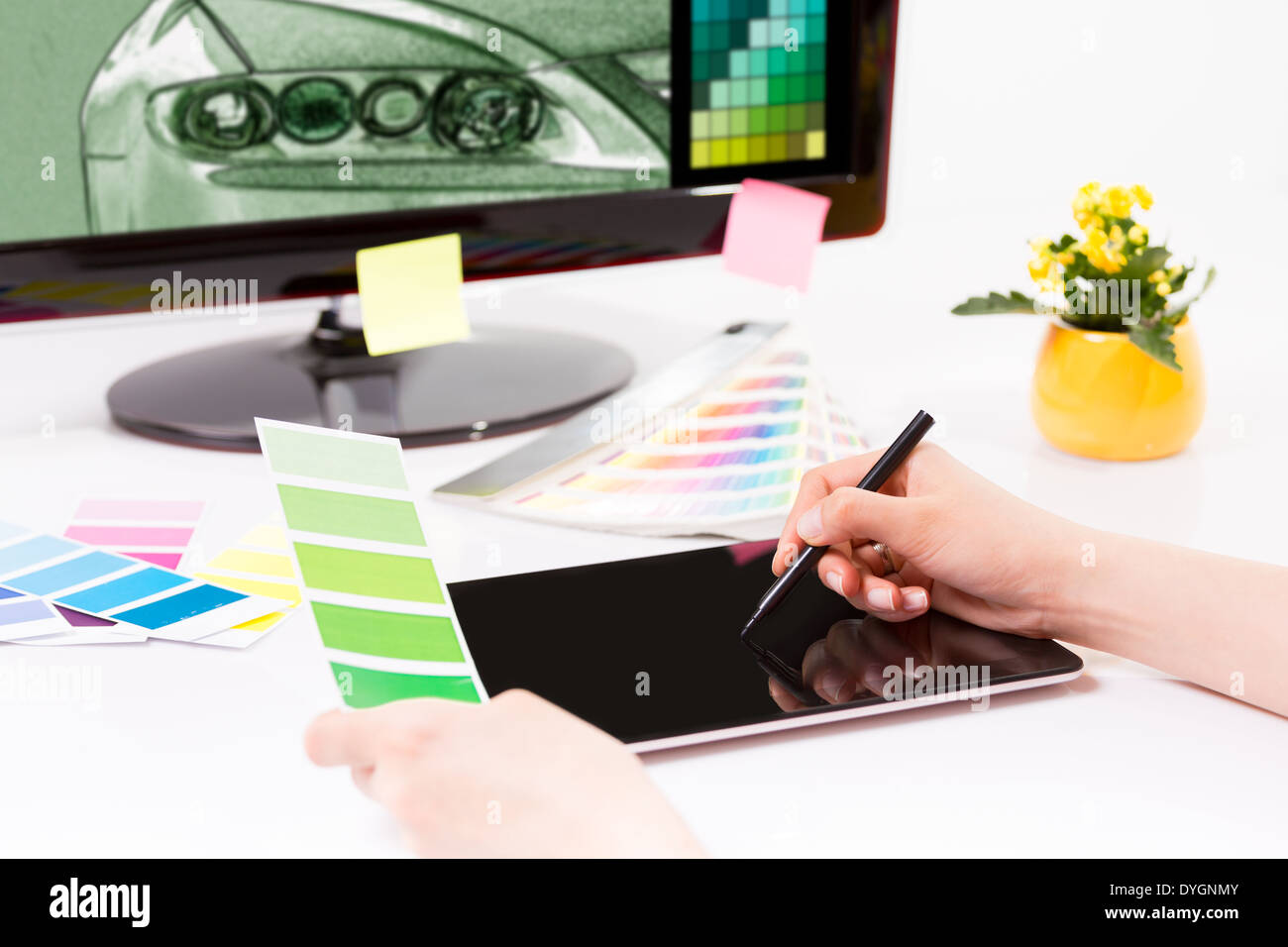 Graphic designer at work. Color swatch samples. Stock Photo