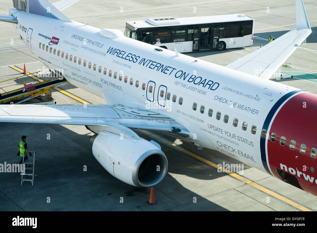 Norwegian.com airplane / plane painted to promote / advertise FREE mobile internet WIFI for passengers on the aircraft Stock Photo