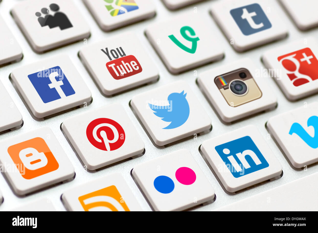 BELCHATOW, POLAND - MAY 02, 2013: Modern white keyboard with colored social network buttons. Stock Photo