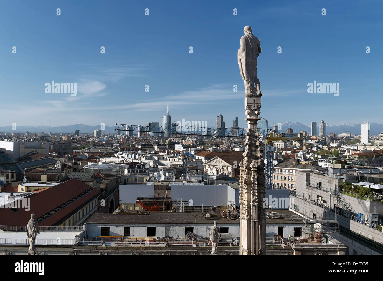 Milan spires statues landmarks Duomo terrace city rooftop panorama Stock Photo