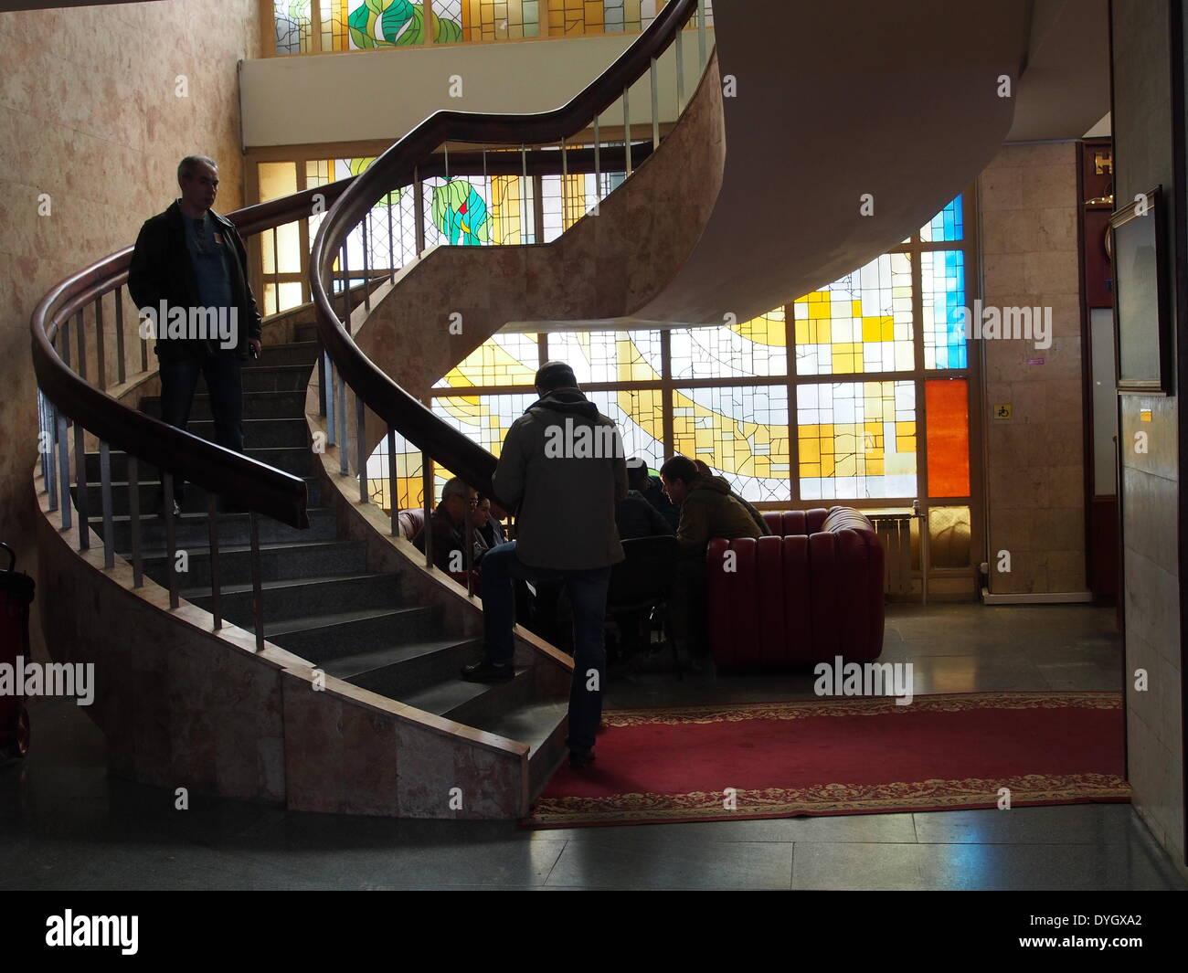 Three alleged OSCE diplomats (L) in the 'Lugan' hotel lobby discuss submissions from pro-Russian supporters who have seized the Ukrainian regional office of the Security Service in Lugansk. Stock Photo