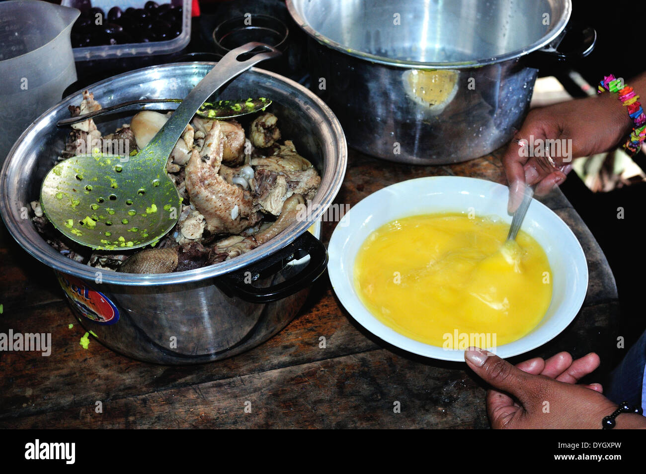 Mixing rice with beaten egg Elaboration of Juanes by traditional