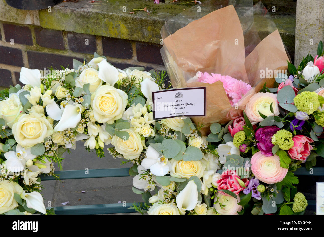 St James Square, London, 17 April 2014, WPC Yvonne Fletcher's mother Queenie supported by family attend a memorial service 30 years after her killing outside the Lybian Embassy. Credit:  JOHNNY ARMSTEAD/Alamy Live News Stock Photo