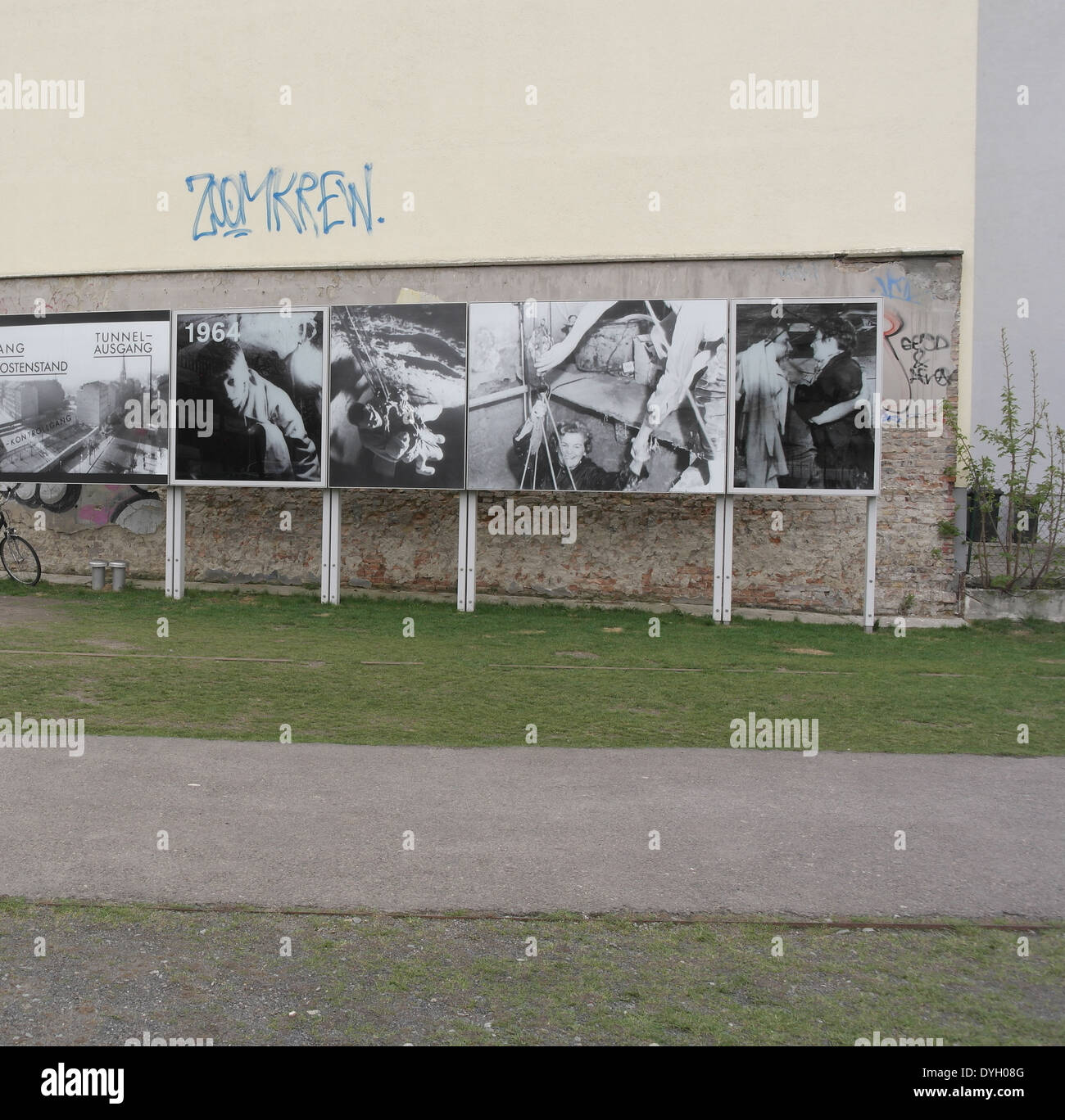 Monochrome photographs 1964 Tunnel 57 escapees, on boards base of building, Berlin Wall, Bernauer Strasse at Strelitzer Strasse Stock Photo