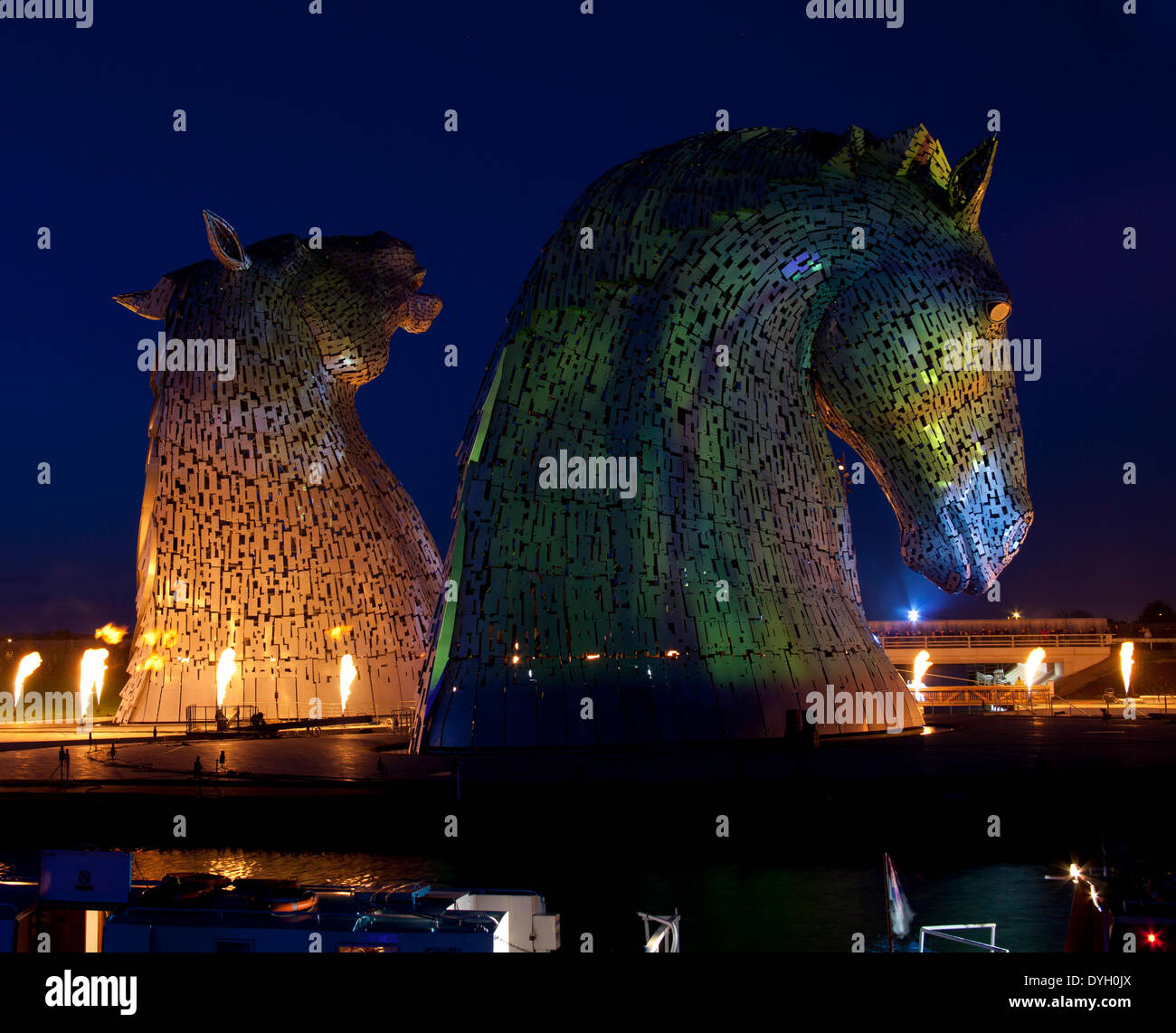 The Helix project, Falkirk, Scotland, UK. 17th Apr.2014. Andy Scott’s giant equine artworks 'The Kelpies' the illuminated spectacular, The Kelpies are 30 metre high horse-head sculptures, standing next to the Forth and Clyde Canal in The Helix, a new parkland project built to connect 16 communities in the Falkirk Council Area, Scotland Stock Photo