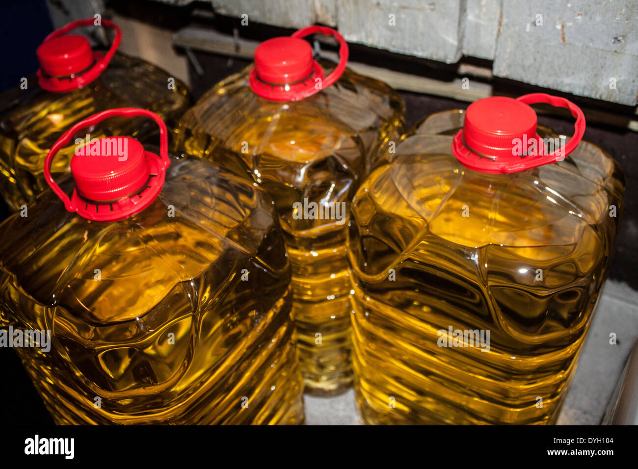 Four containers of deep fryer oil Stock Photo Alamy