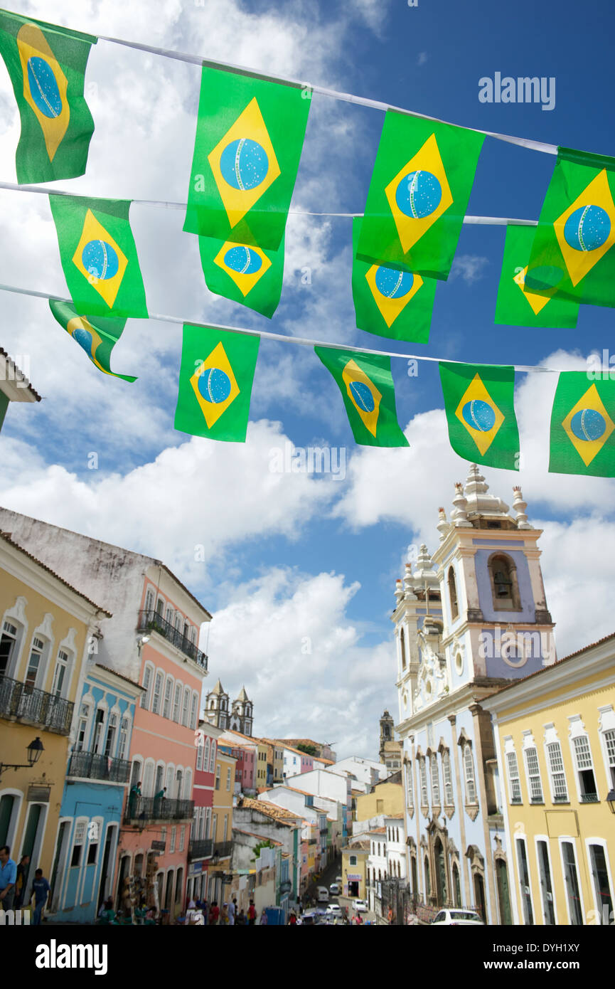 Brazilian flag bunting fluttering over historic city center colonial architecture of Pelourinho Salvador da Bahia Brazil Stock Photo