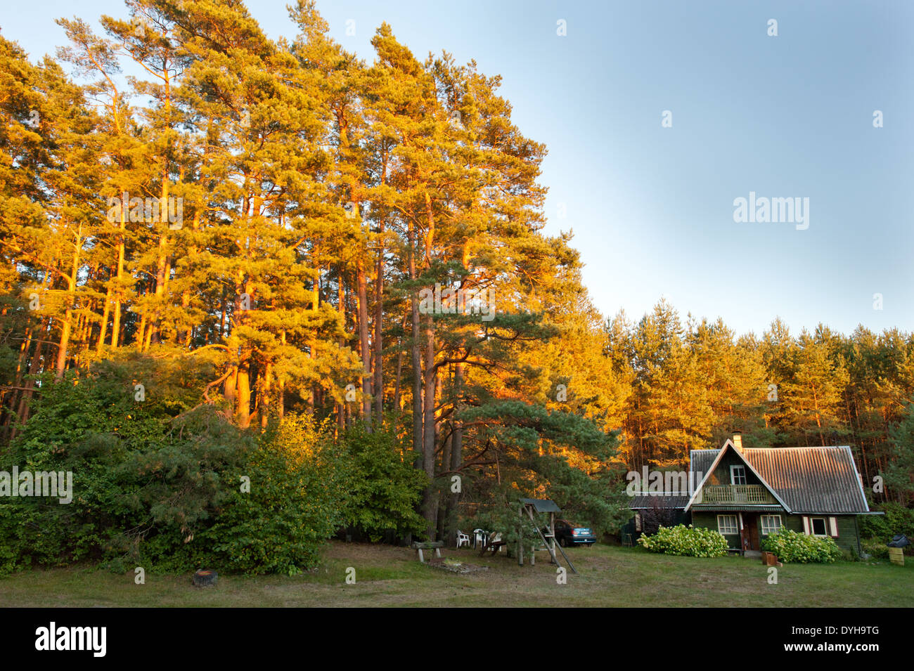 A Sodyba or typical wooden, countryside summer house in rural Lithuania. Found across Eastern Europe with land for growing food and relaxing in nature Stock Photo