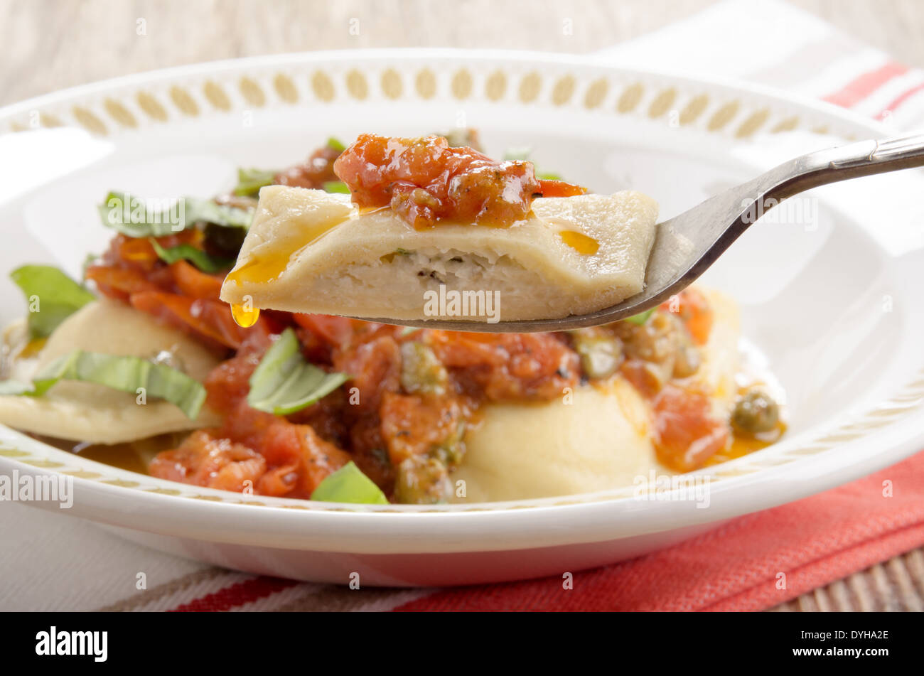 italian ravioli with soft cheese basil filling and sauce from tomatoes