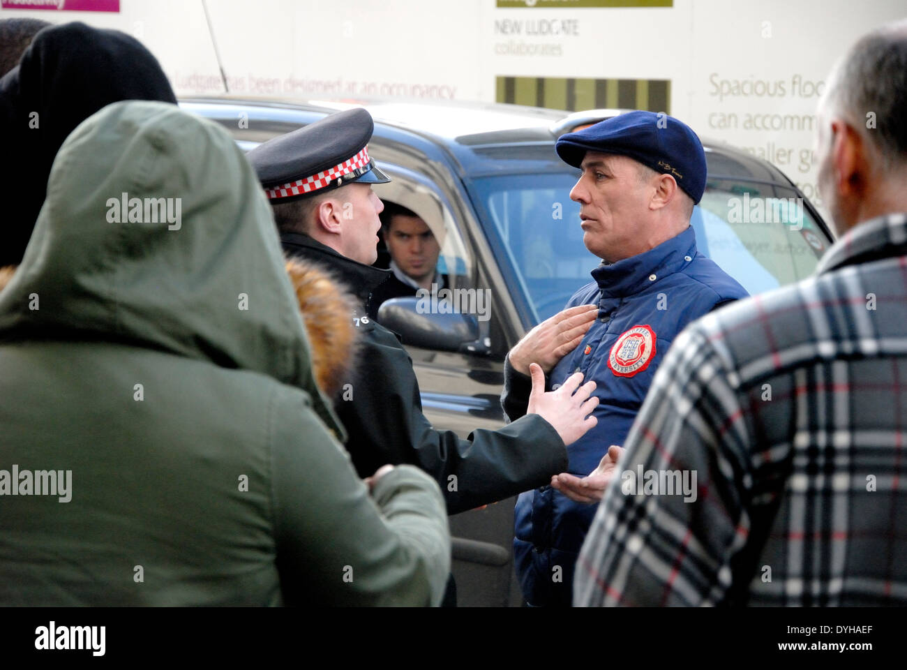 Confrontation between police officer and a protester at the Lee Rigby Murder Trial Sentencing - Old Bailey 26 Feb 2014. Stock Photo