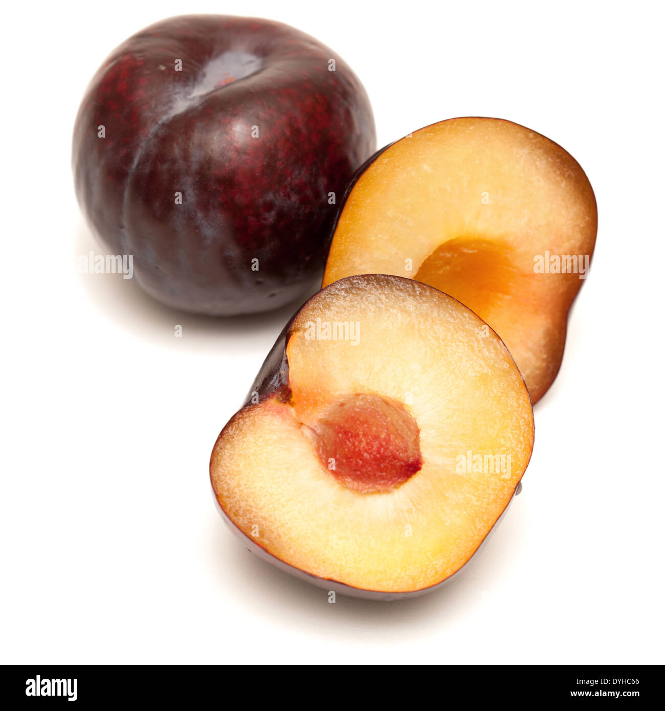 dark red plums isolated on white Stock Photo Alamy