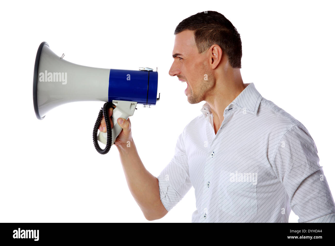 Crazy man screaming in megaphone on white background Stock Photo