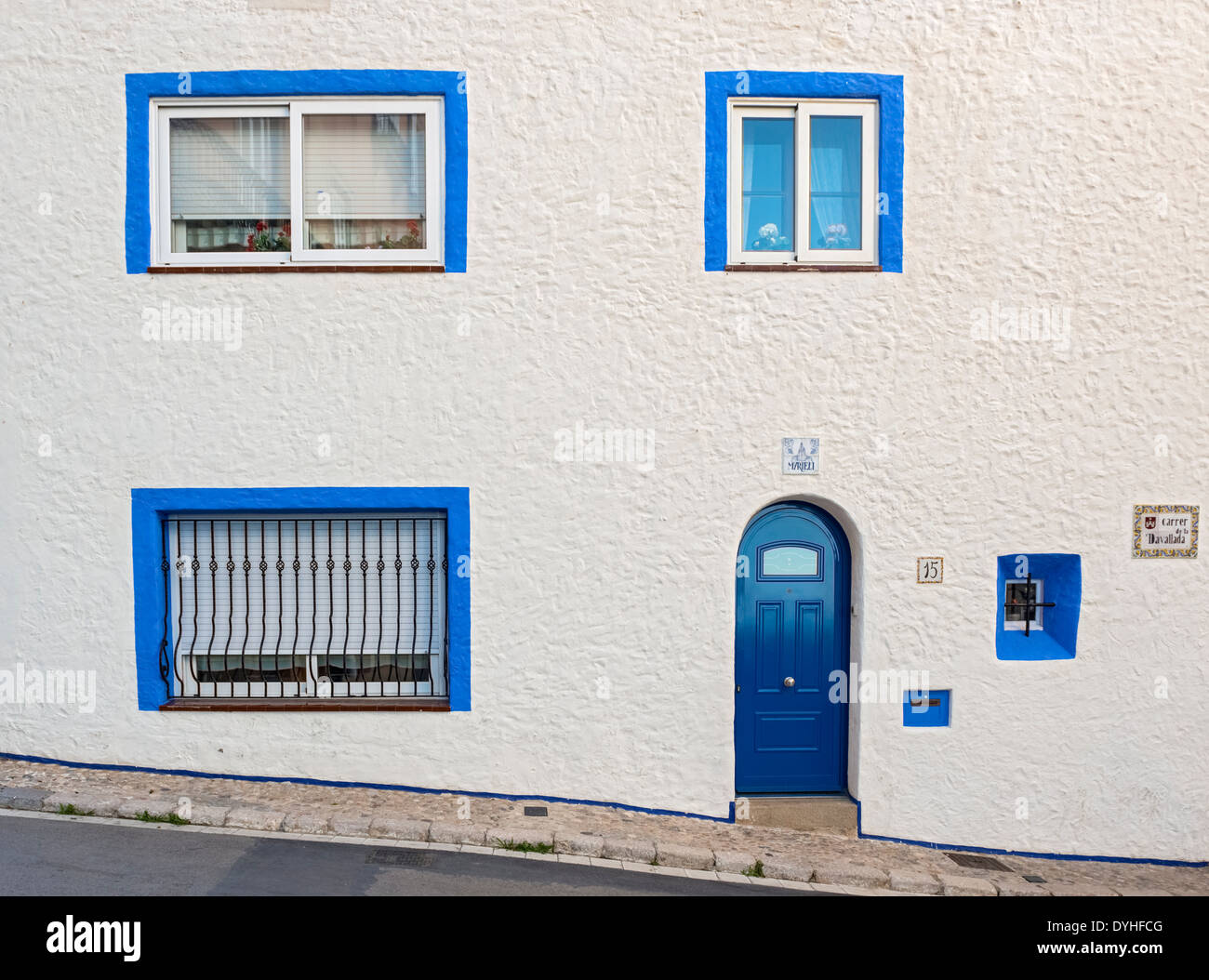 View at old house when walking the street in Sitges, Spain. Stock Photo