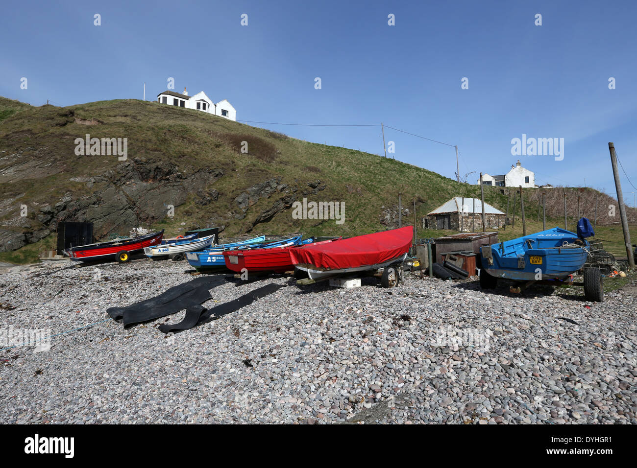 Small fishing boats at the picturesque harbour at Cove Bay, Aberdeen city, Scotland, UK Stock Photo