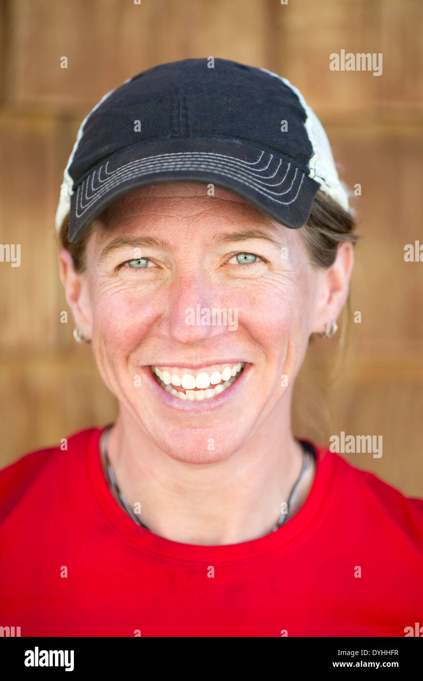 A portrait of a smiling woman, just after finishing her fastpack of 170 miles around the Tahoe Rim Trail in just six days, NV. Stock Photo