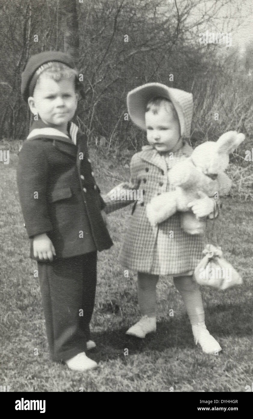 Little boy and girl with girl holding bunny in New Jersey, circa 1940 Stock Photo