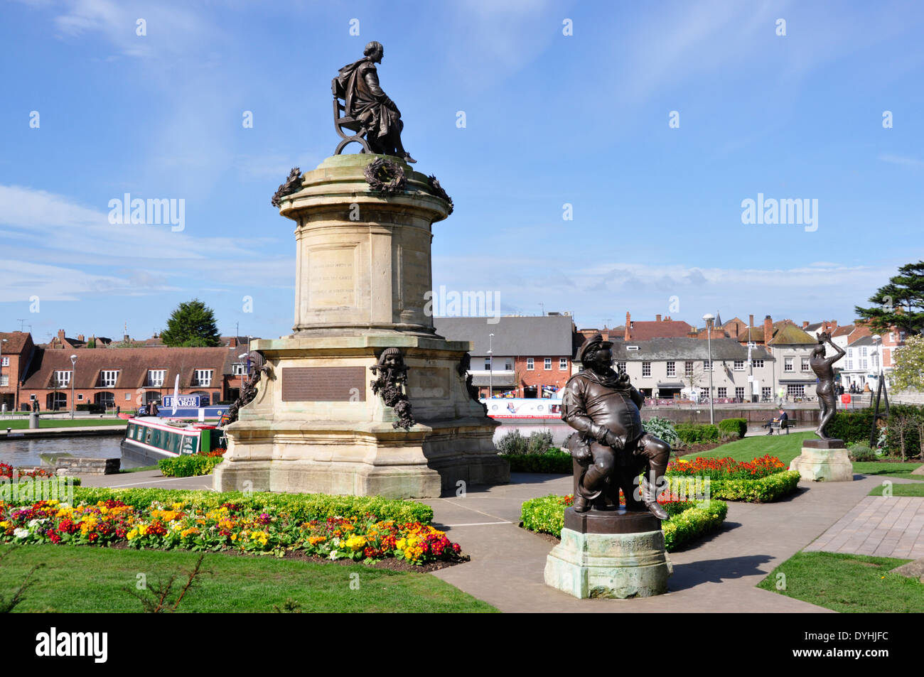 Stratford on Avon - Bancroft riverside gardens - elevated memorial statue William Shakespeare - sunlight - blue sky backdrop Stock Photo