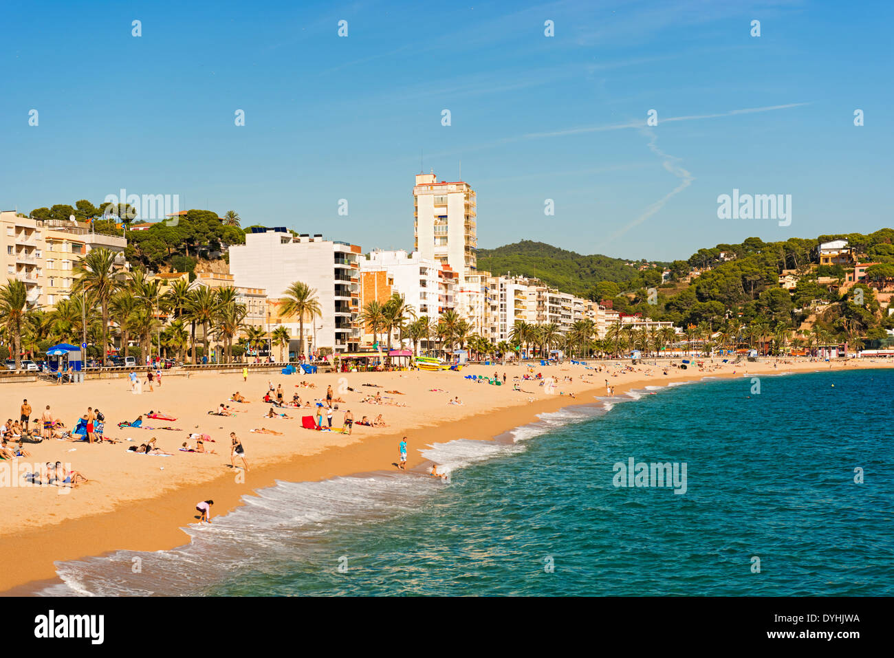 Lloret de Mar, Spain - October 13: Tourists enjoy beach in Lloret de Mar on Costa Brava shores on October 13, 2013 Stock Photo