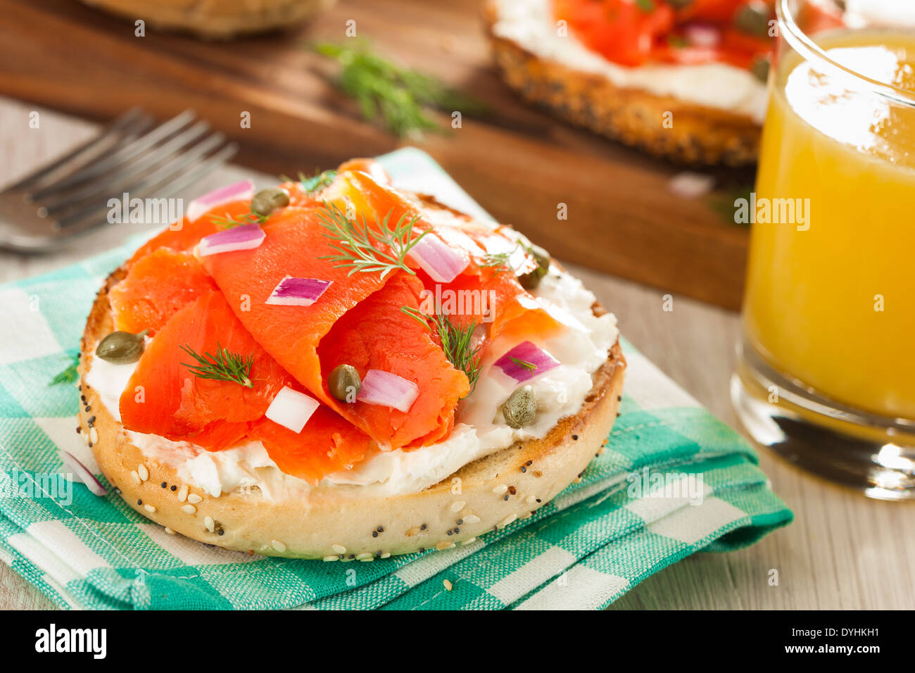 Homemade Bagel and Lox with Cream Cheese, Capes, and Dill Stock Photo