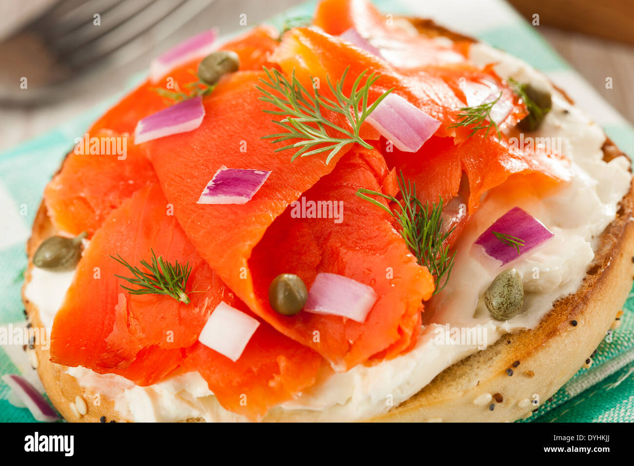 Homemade Bagel and Lox with Cream Cheese, Capes, and Dill Stock Photo