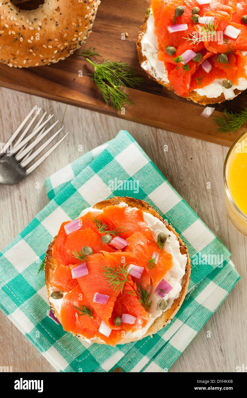 Homemade Bagel and Lox with Cream Cheese, Capes, and Dill Stock Photo