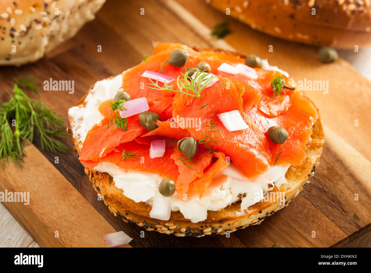 Homemade Bagel and Lox with Cream Cheese, Capes, and Dill Stock Photo