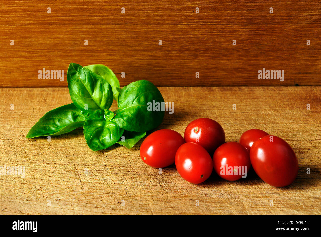 Cherry tomatoes and basil Stock Photo