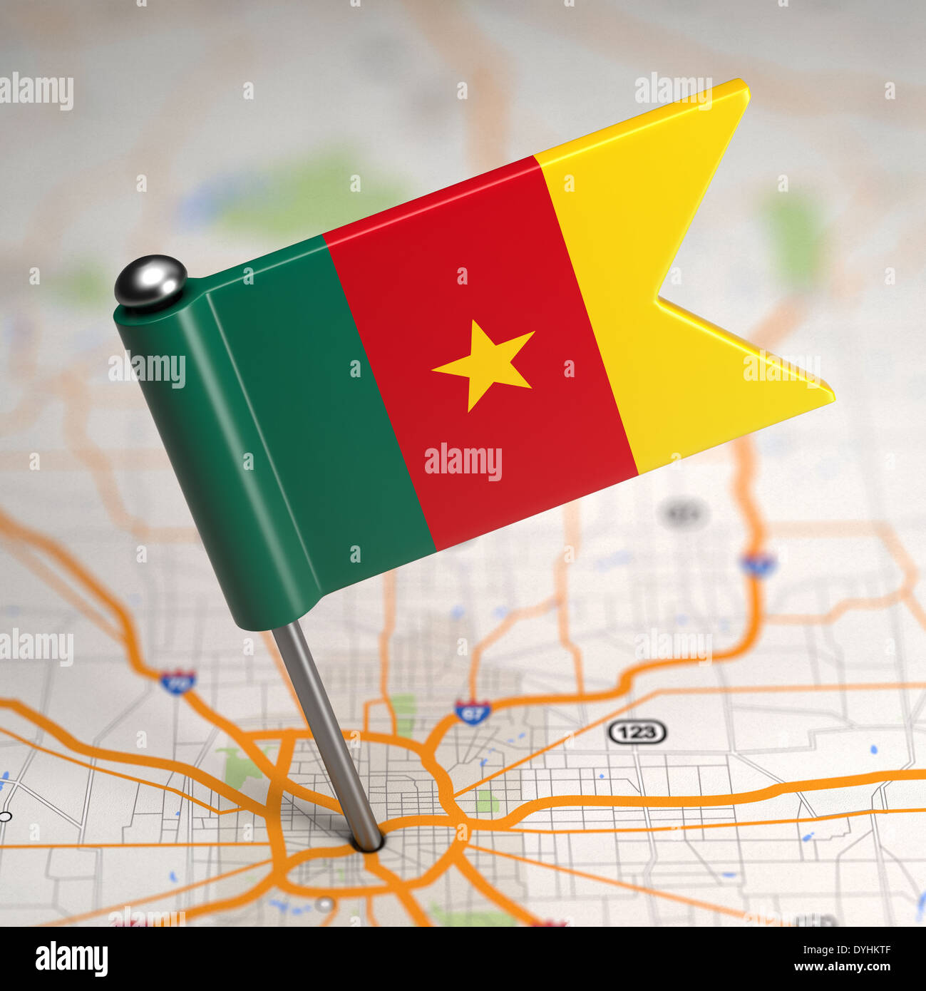 Cameroon Small Flag on a Map Background. Stock Photo