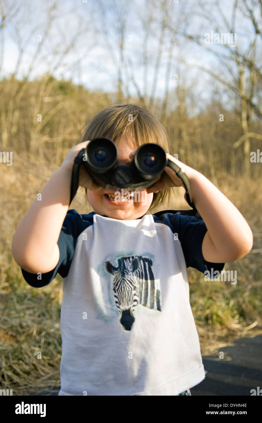 3 Year Old Boy Playing with Binoculars at Mount Saint Francis in Floyd County, Indiana Stock Photo