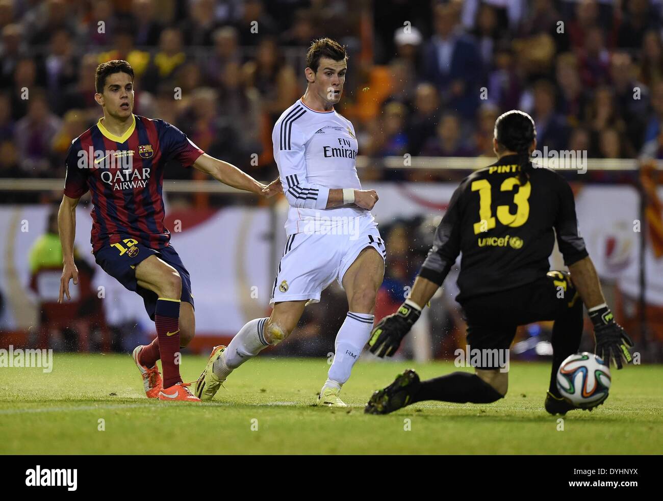 Mestalla, Valencia, Spain. 16th Apr, 2014. Copa Del Rey Cup final.  Barcelona versus Real Madrid. Gareth Bale (Real Madrid) scores the goal for  1-2 past keeper Jose Pinto (Barca) and Marc Bartra (