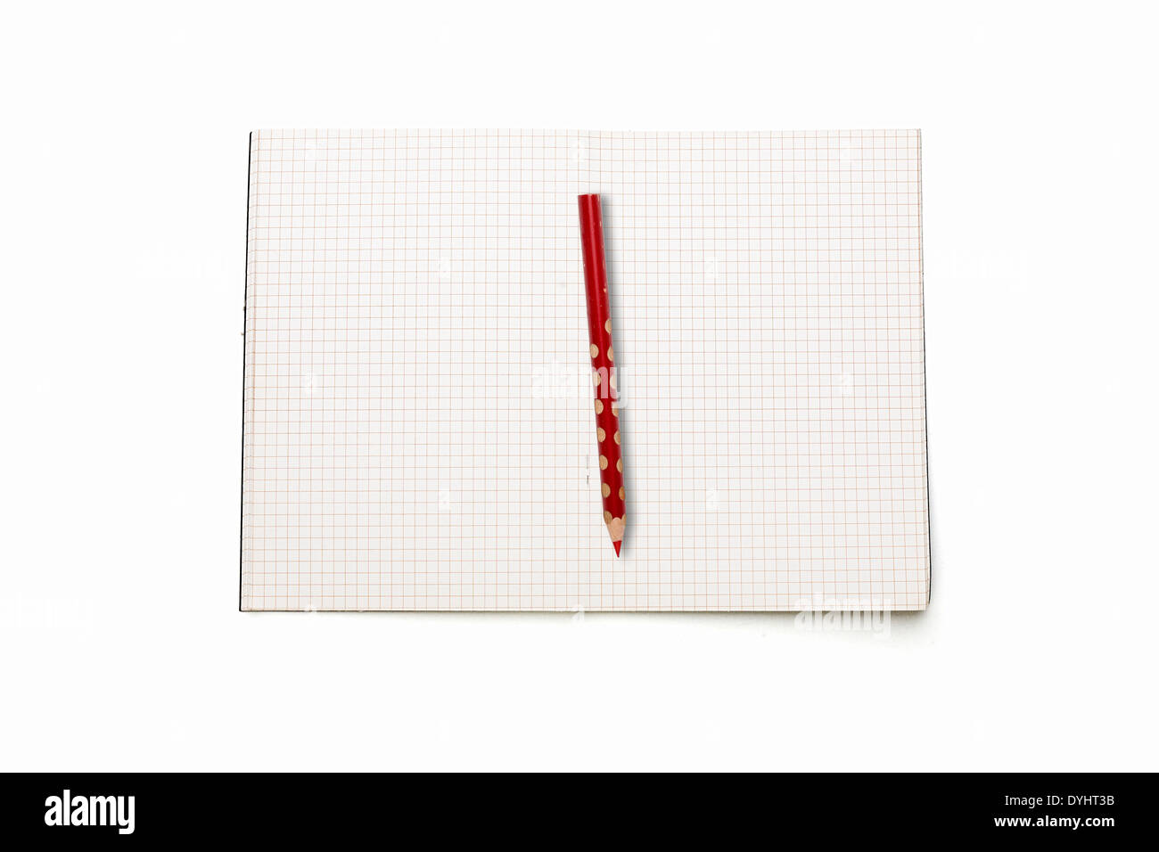 open squared blank book with red pencil, isolated on white . Stock Photo