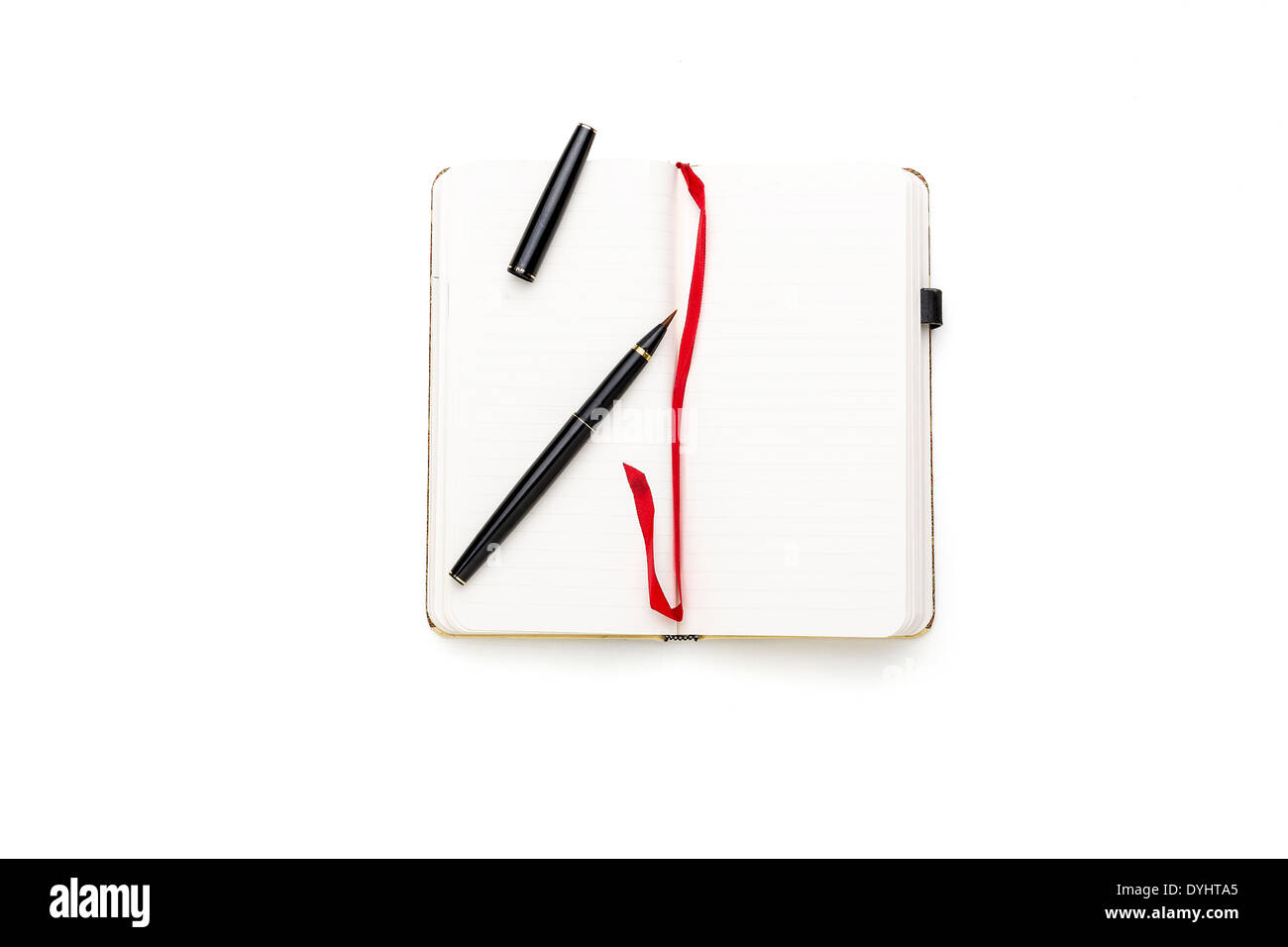open blank diary with japanese pen brush and red bookmark, isolated on white. Stock Photo