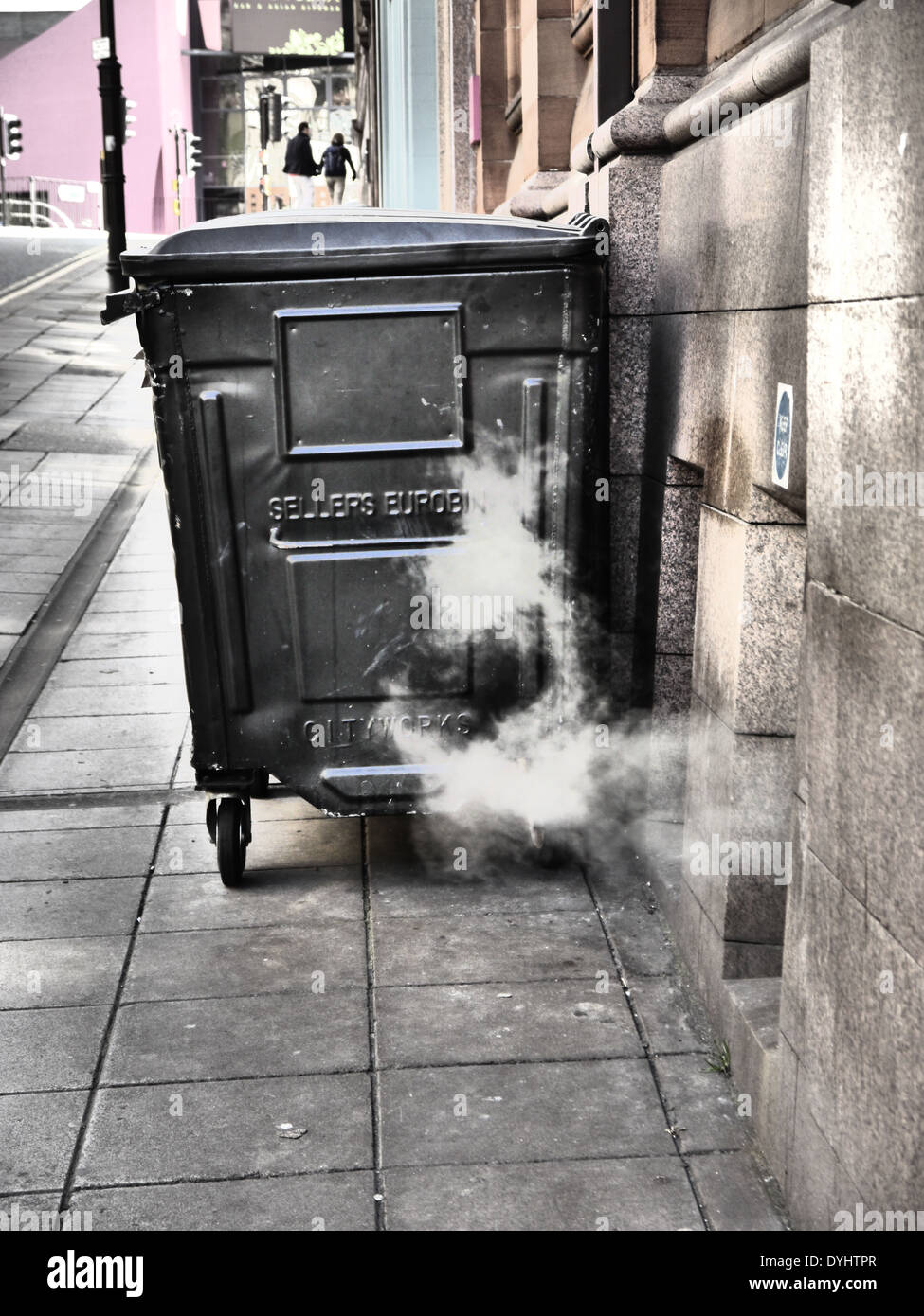 Creative / artistic photographic image of wheelie refuse bin and steam