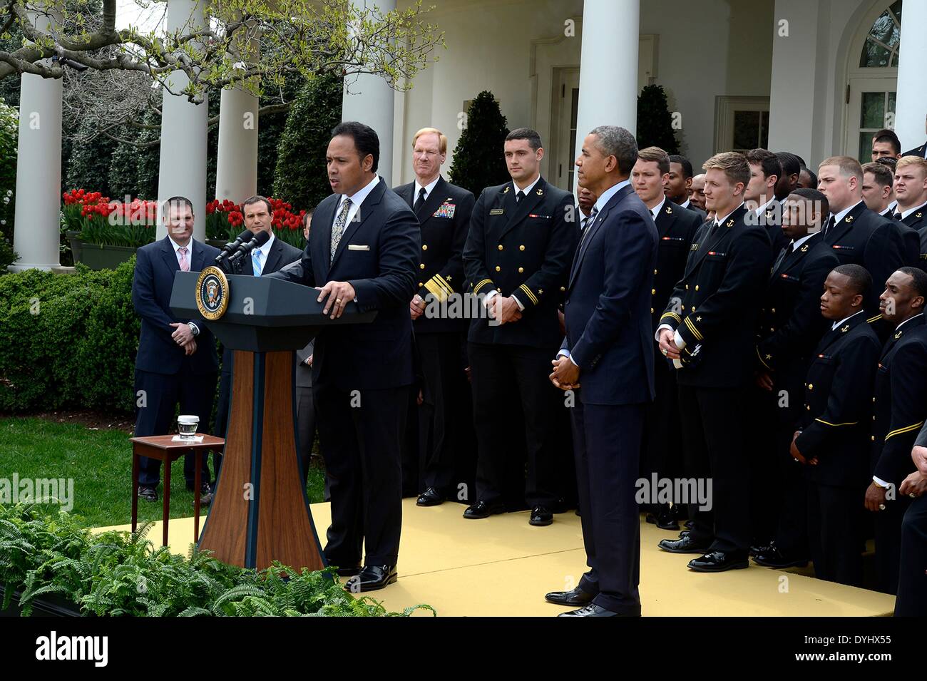 Ken Niumatalolo, the head coach of the U.S. Naval Academy football team thanks President Barack Obama during an event on the South Lawn of the White House April 18, 2014 in Washington, D.C. The president presented the Navy Midshipmen with the Commander-in-Chief's Trophy, which goes to the Department of Defense academy team with the most victories against its Service rivals. Stock Photo
